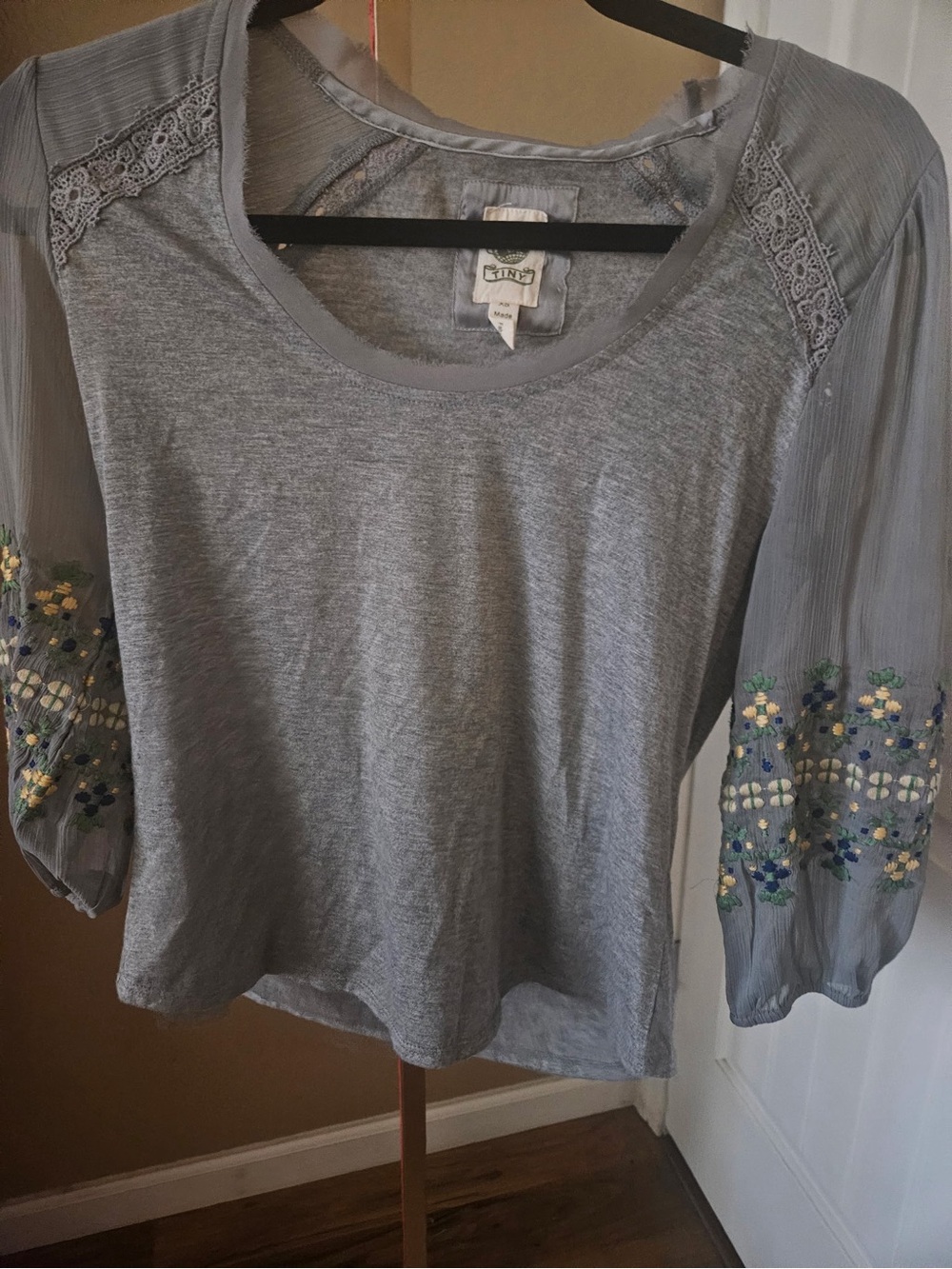 Anthropologie Tiny Julia Embroidered Top w/sheer, floral-embroidered sleeves.